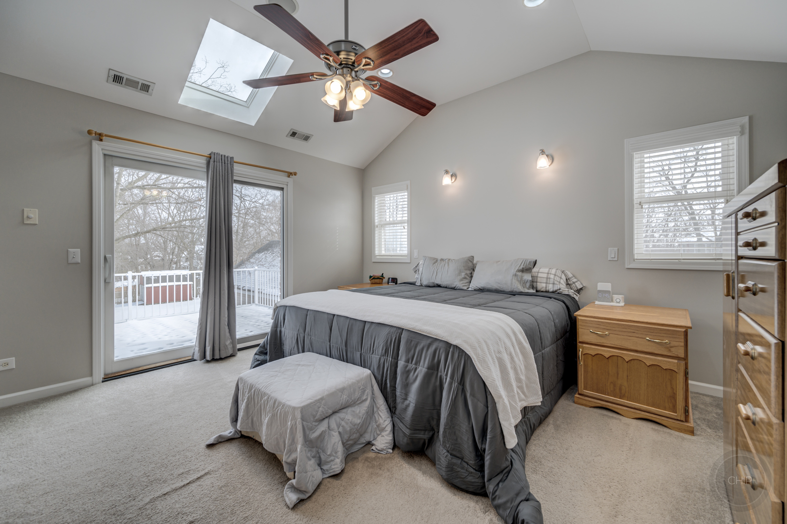 5S263 Middle Road Naperville, IL 60563 - Photo 18 of 46 a spacious bedroom with a bed and a chandelier