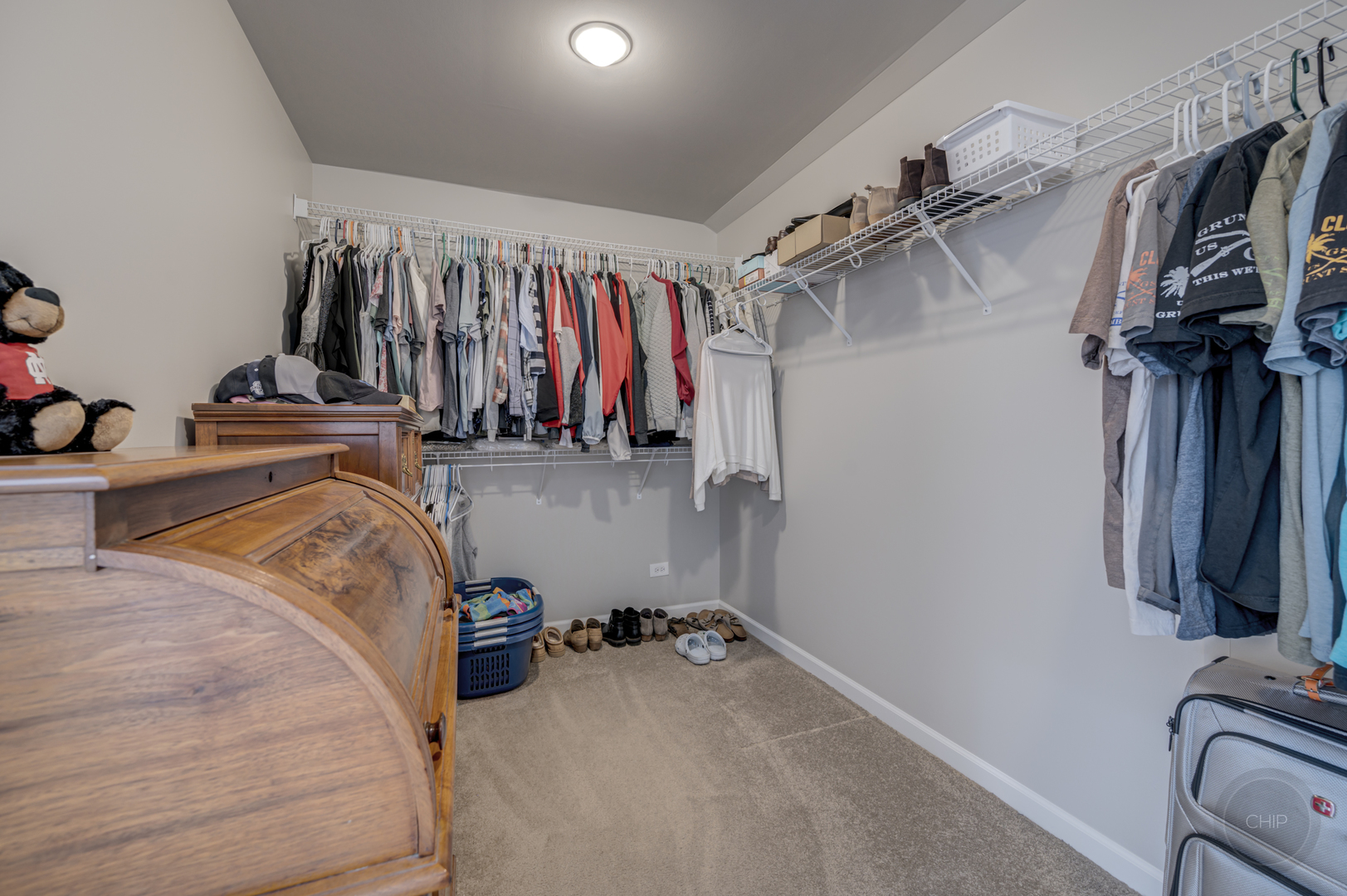 5S263 Middle Road Naperville, IL 60563 - Photo 21 of 46 a view of walk in closet with clothes and shoes