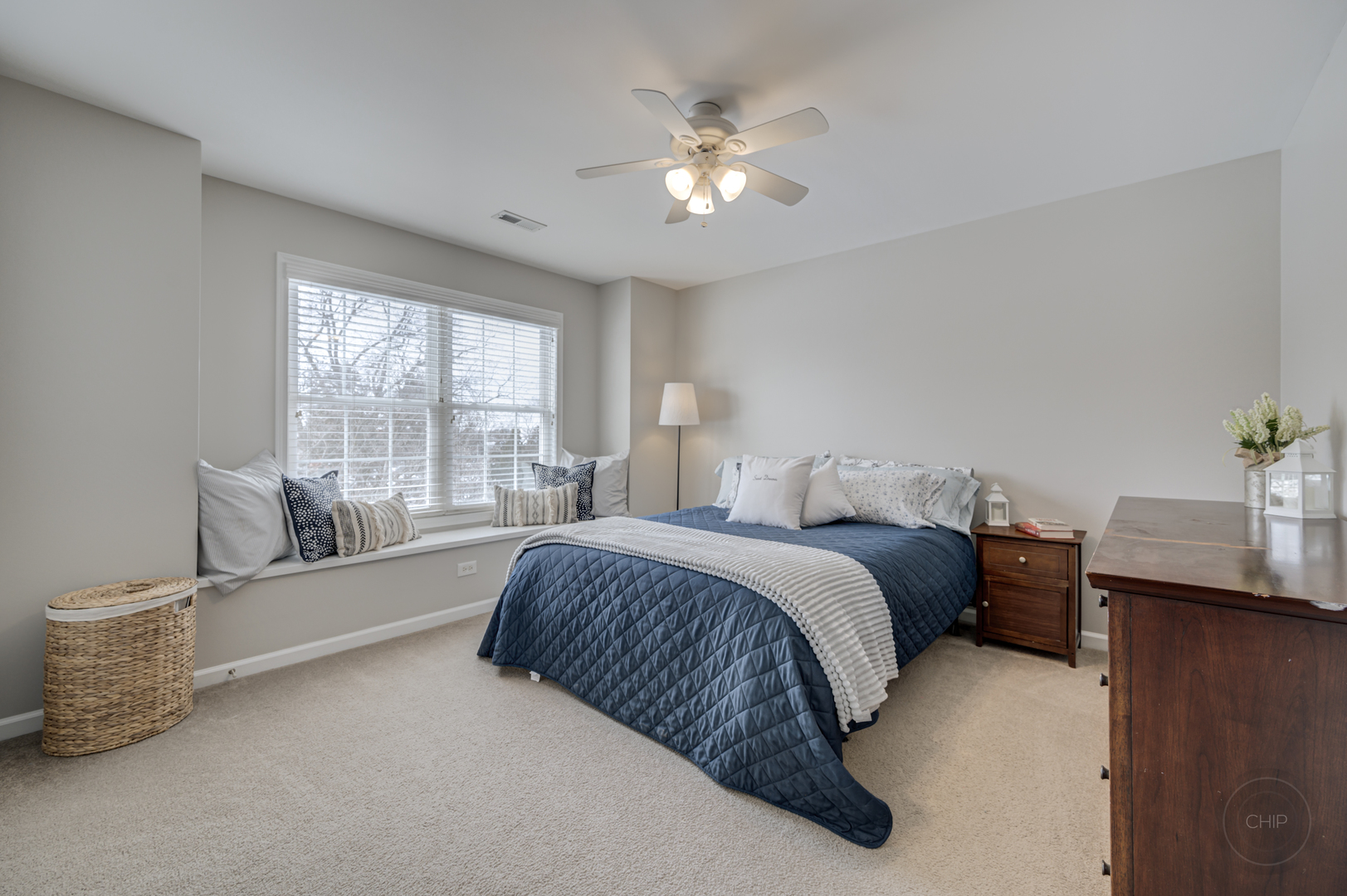 5S263 Middle Road Naperville, IL 60563 - Photo 27 of 46 a spacious bedroom with a bed and a chandelier