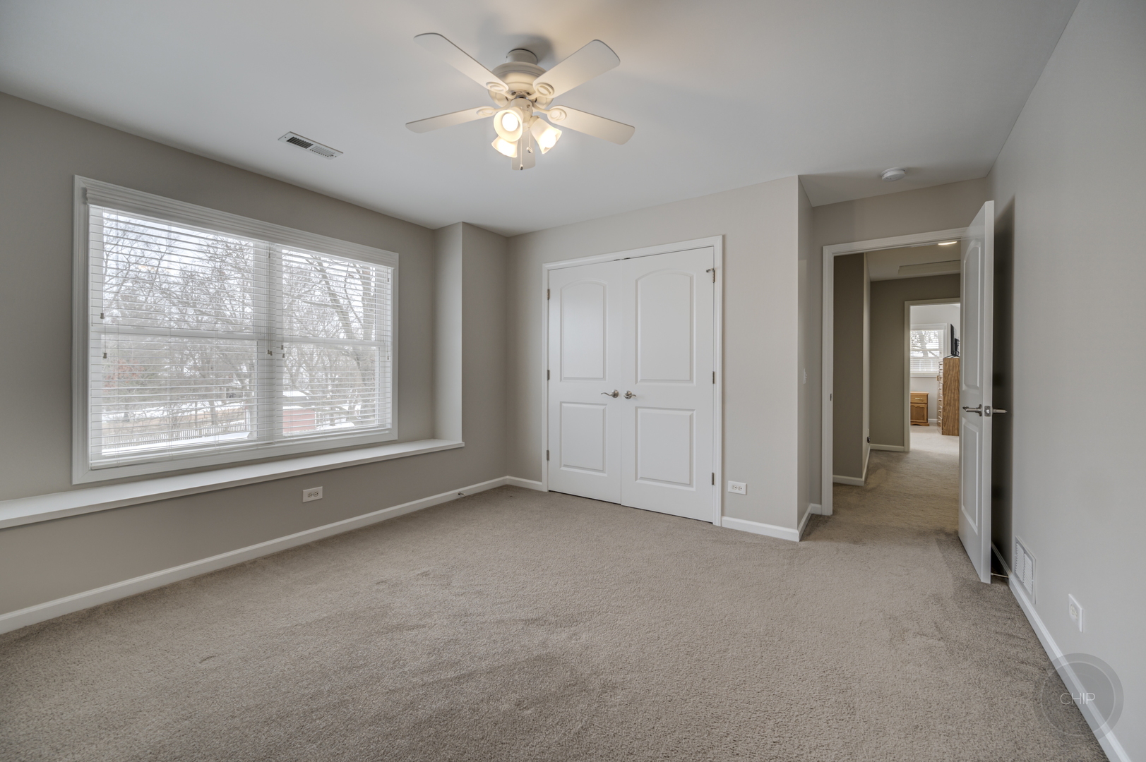 5S263 Middle Road Naperville, IL 60563 - Photo 28 of 46 an empty room with chandelier fan and windows