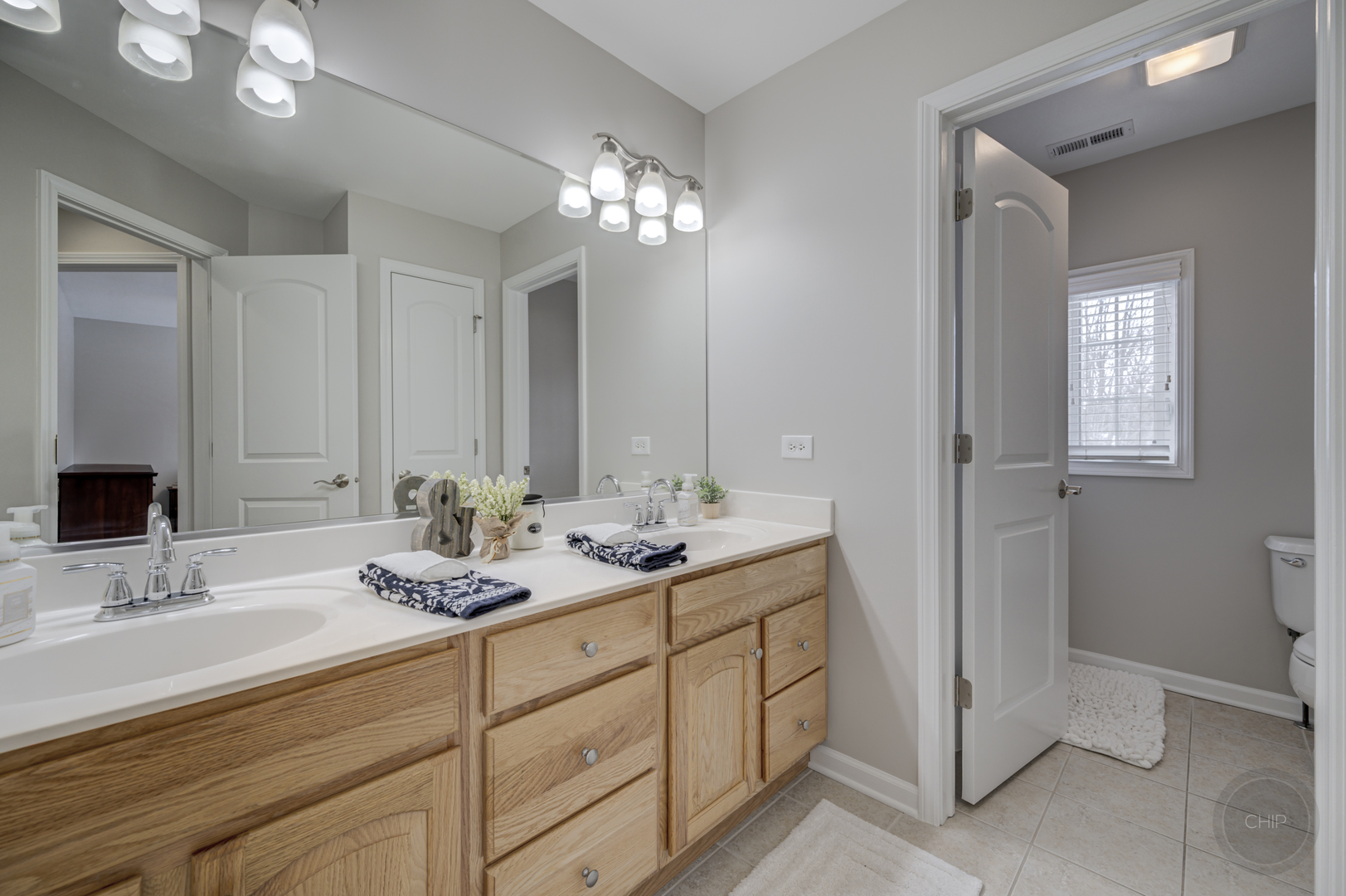 5S263 Middle Road Naperville, IL 60563 - Photo 29 of 46 a bathroom with double sink and a mirror