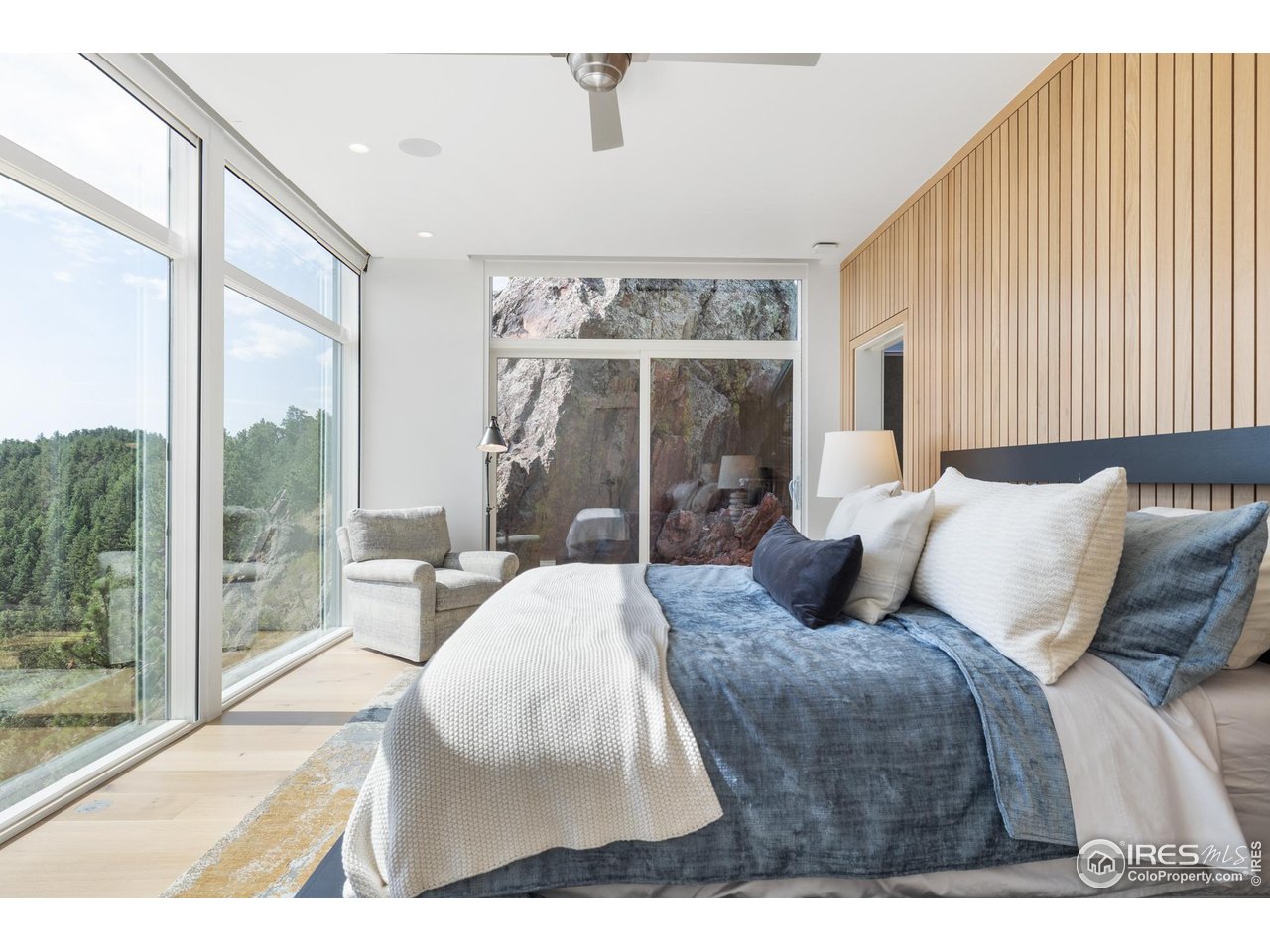 1145 Timber Lane Boulder, CO 80304 - Photo 13 of 40 a bedroom with a large bed and a large window