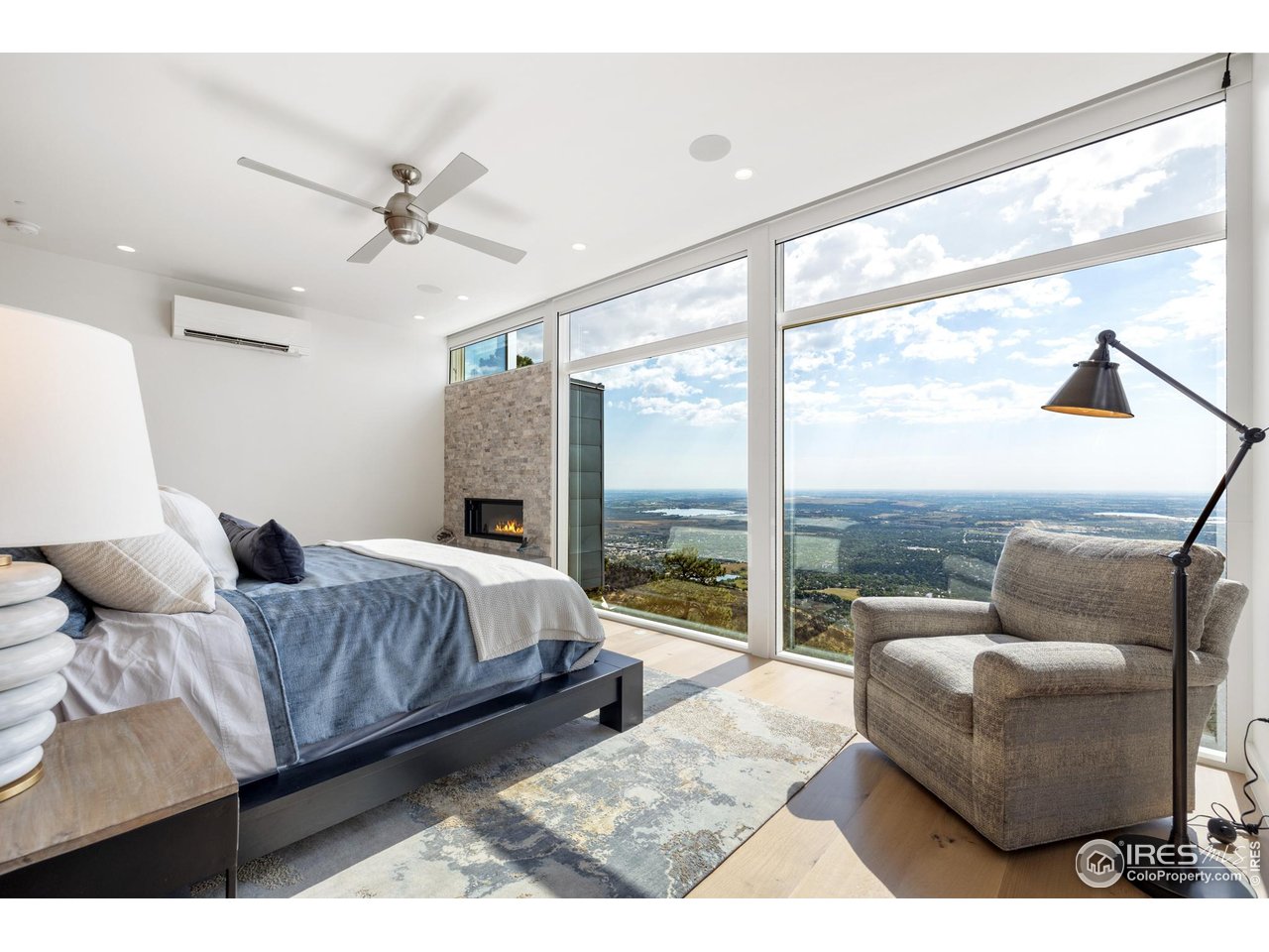 1145 Timber Lane Boulder, CO 80304 - Photo 14 of 40 a bedroom with a bed and glass window