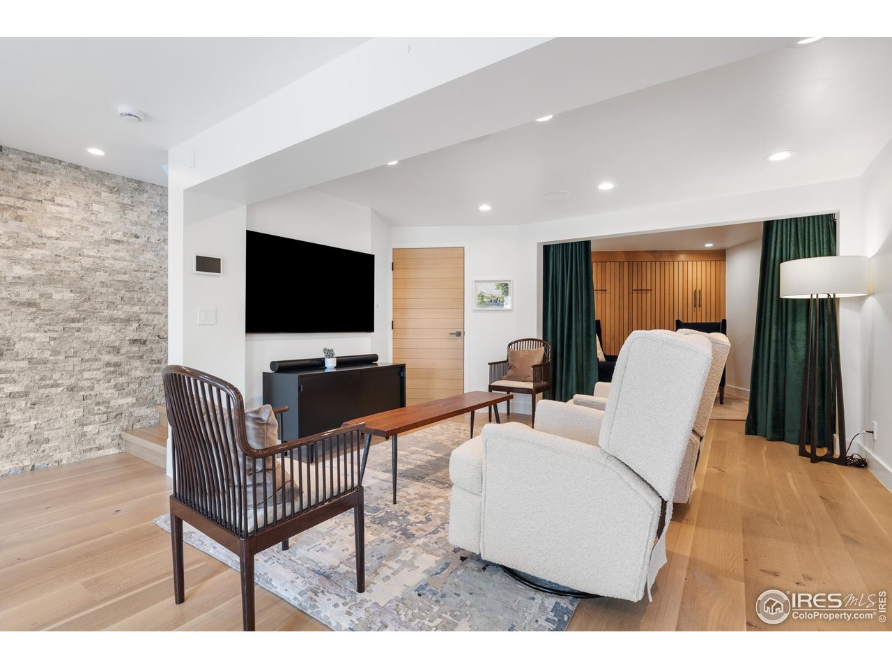 1145 Timber Lane Boulder, CO 80304 - Photo 28 of 40 a living room with furniture and a flat screen tv