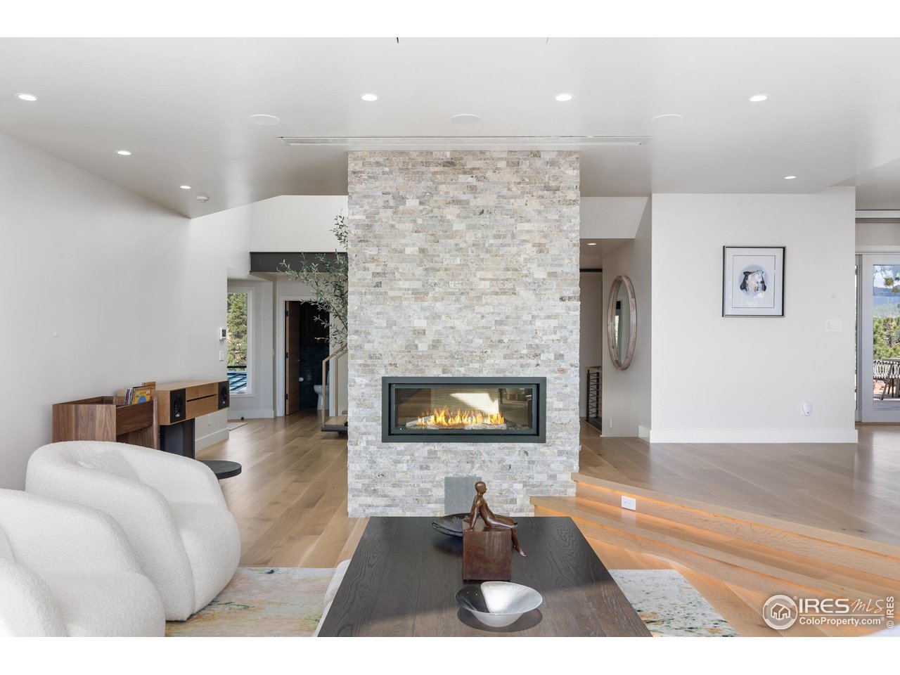 1145 Timber Lane Boulder, CO 80304 - Photo 4 of 40 a living room with furniture and a fireplace