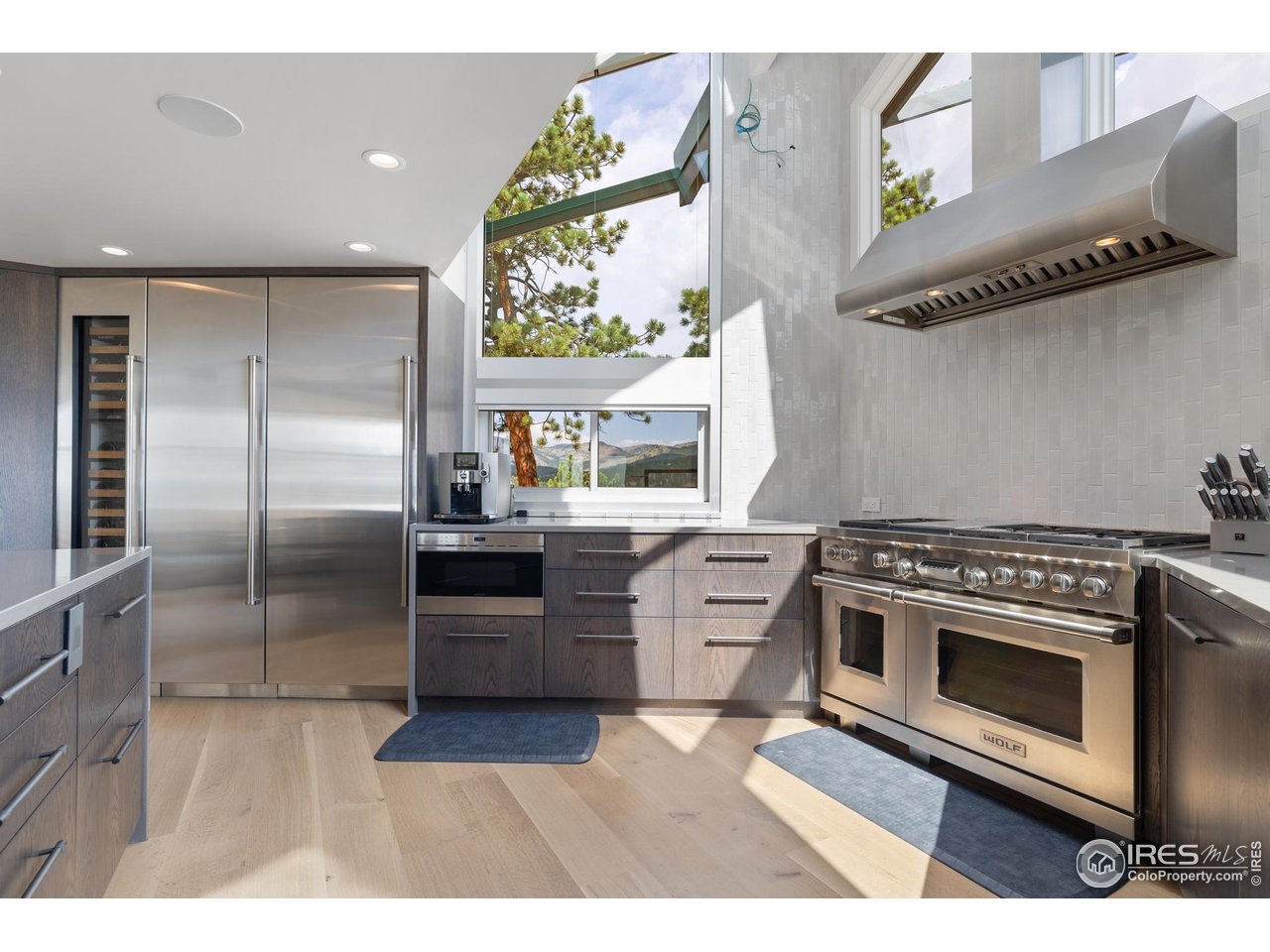 1145 Timber Lane Boulder, CO 80304 - Photo 6 of 40 a kitchen with stainless steel appliances granite countertop a stove a refrigerator and a microwave