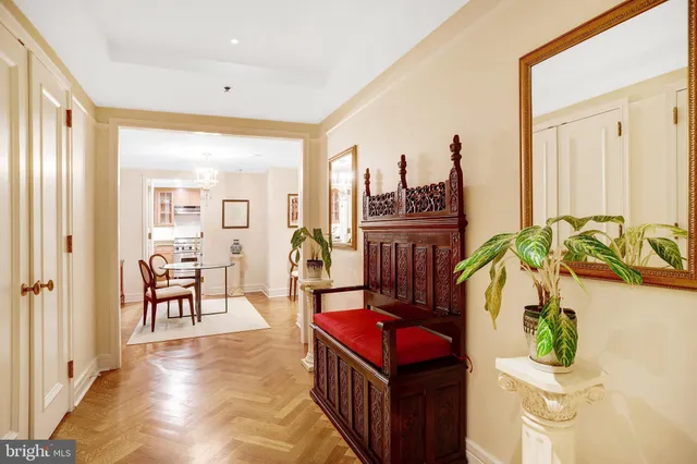a view of a hallway with living room and furniture