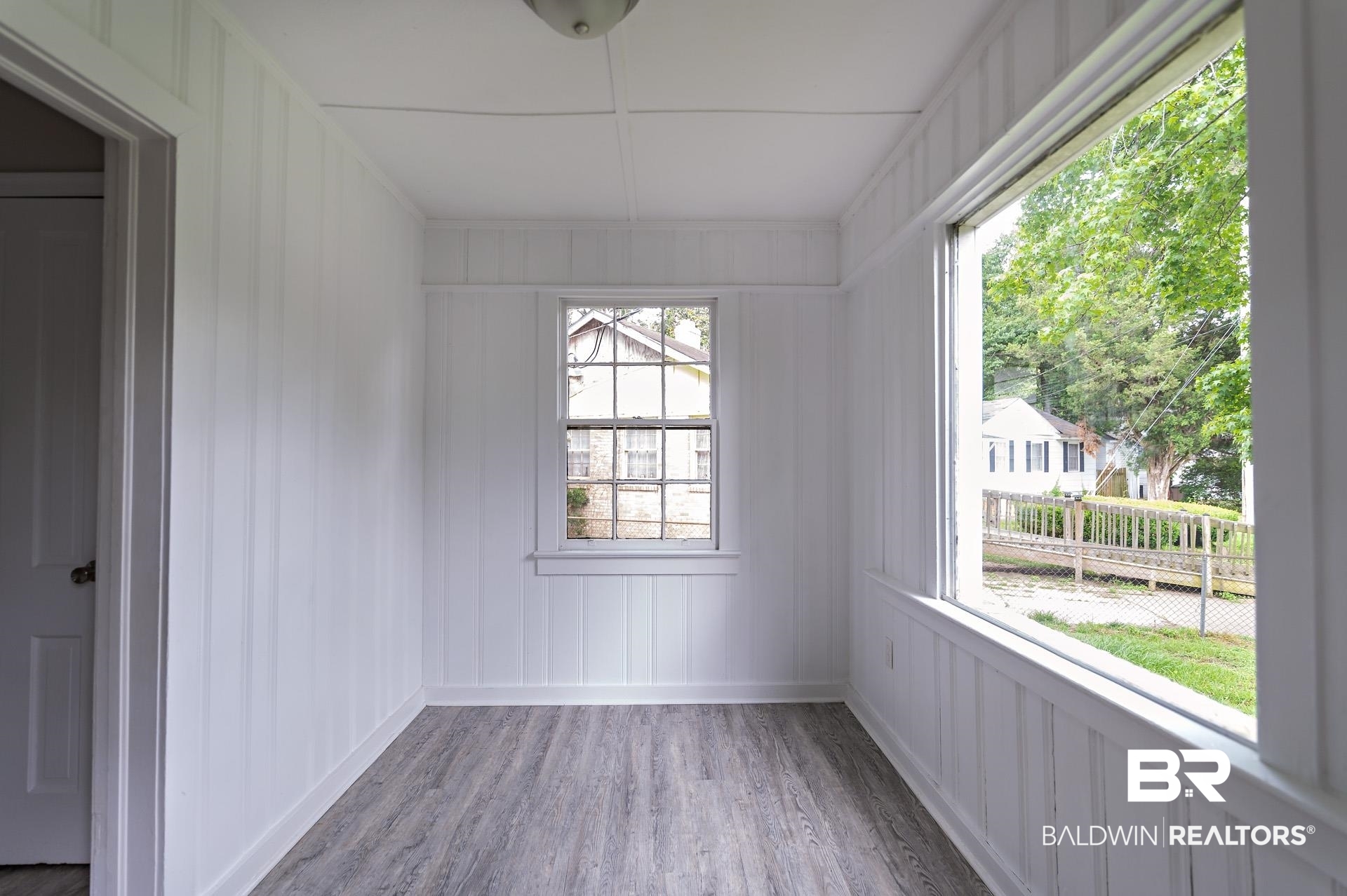 1869 Mott Drive West Mobile, AL 36617 - Photo 13 of 34 Spare room featuring a decorative wall and wood finished floors