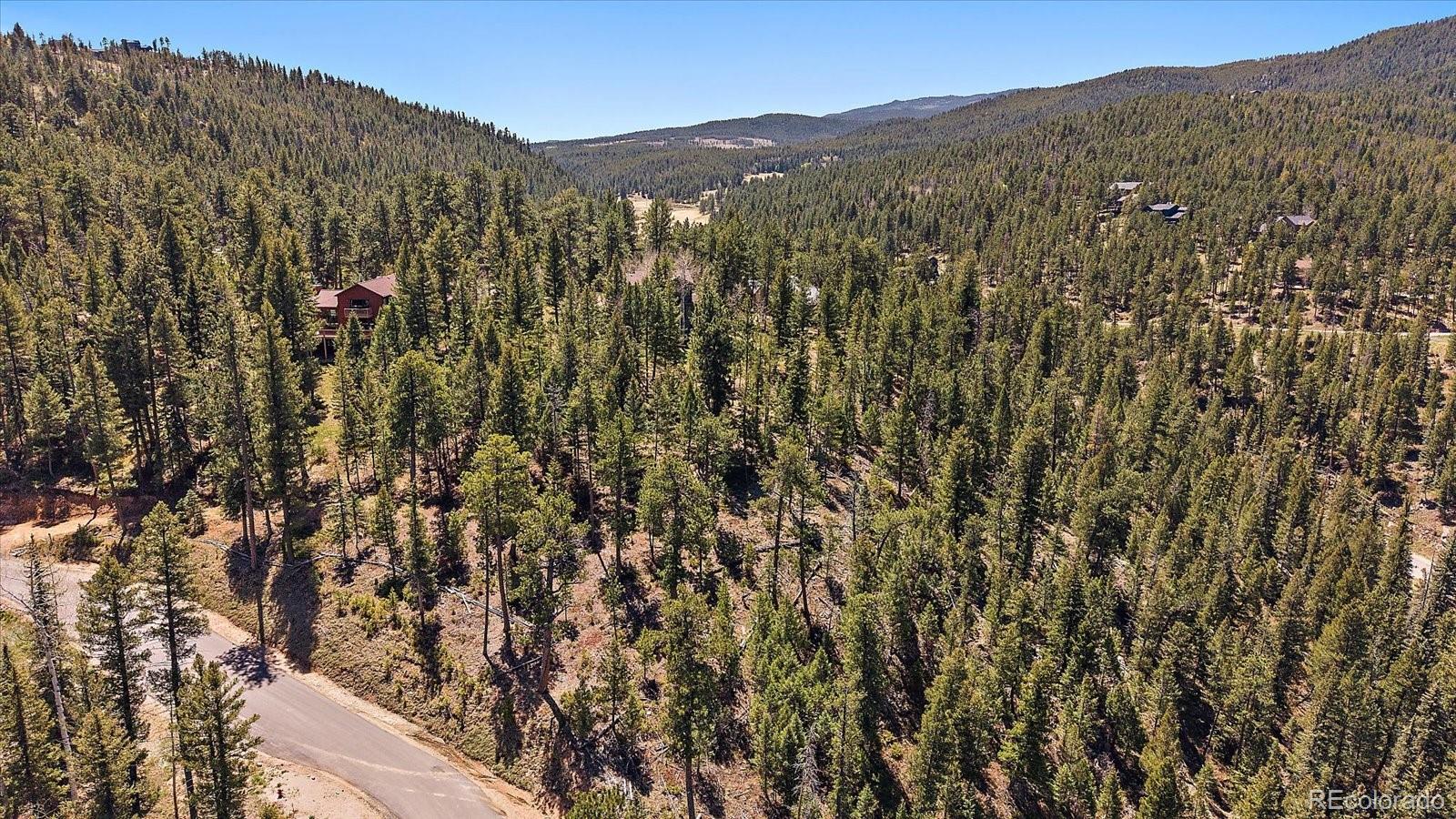 6855 Lynx Lair Road Evergreen, CO 80439 - Photo 7 of 21 a view of a mountain in the distance