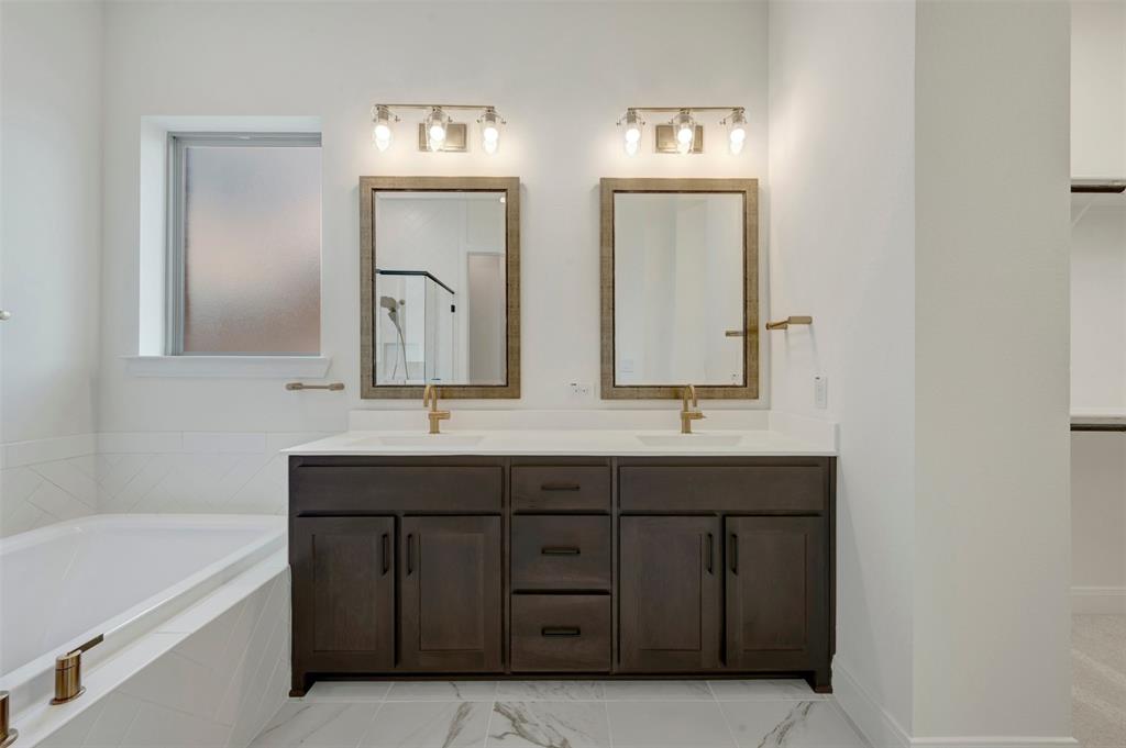 1908 Cola Drive Van Alstyne, TX 75495 - Photo 8 of 29 Dual vanity with dark wood-finish cabinetry and white countertops