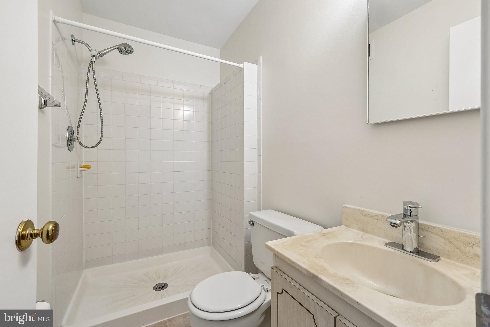 11714 Dry River Court Reston, VA 20191 - Photo 2 of 24 a bathroom with a sink toilet and shower
