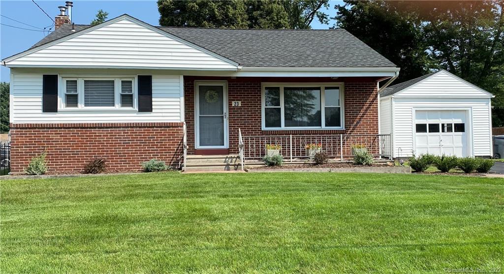 a front view of a house with a yard