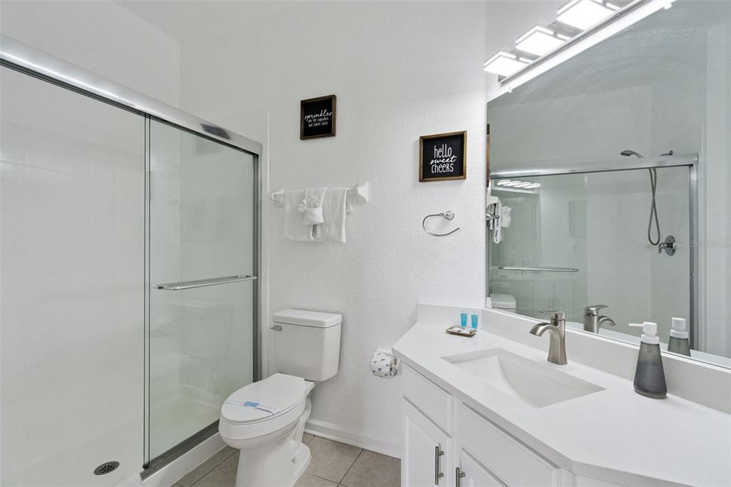 2809 Almaton Loop, Unit 401 Kissimmee, FL 34747 - Photo 21 of 59 a bathroom with a sink toilet and shower