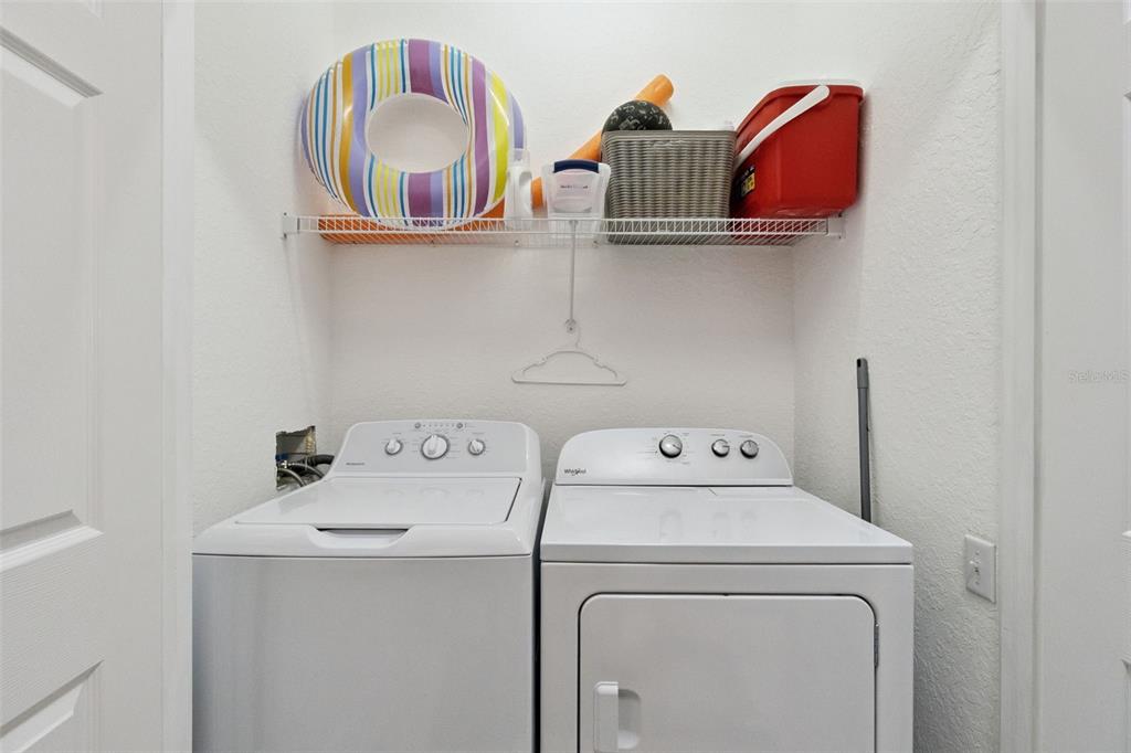 2809 Almaton Loop, Unit 401 Kissimmee, FL 34747 - Photo 22 of 59 a utility room with dryer and washer