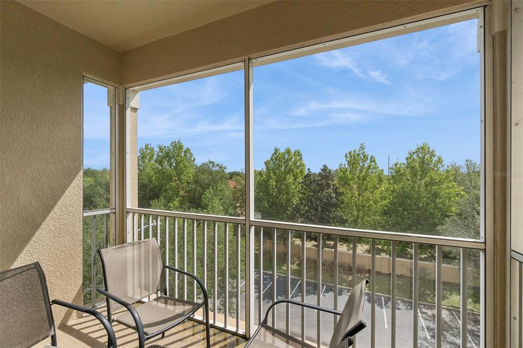 2809 Almaton Loop, Unit 401 Kissimmee, FL 34747 - Photo 23 of 59 a view of a chair and table in the balcony