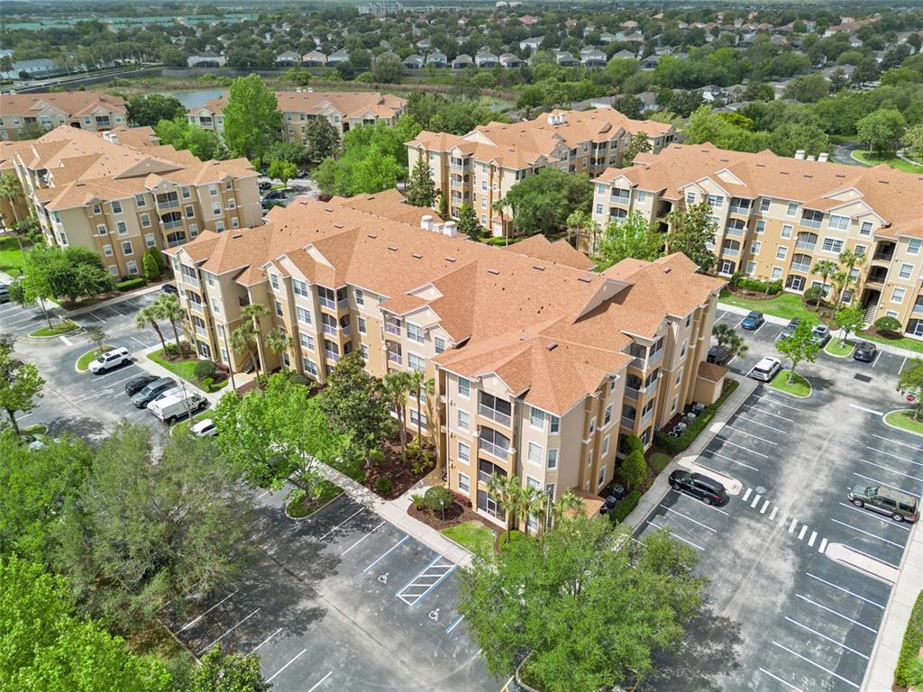 2809 Almaton Loop, Unit 401 Kissimmee, FL 34747 - Photo 25 of 59 an aerial view of multiple houses with yard