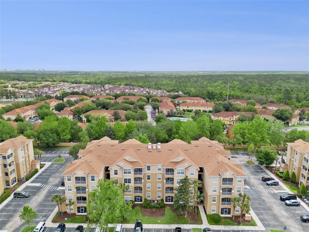 2809 Almaton Loop, Unit 401 Kissimmee, FL 34747 - Photo 30 of 59 an aerial view of residential houses with city view