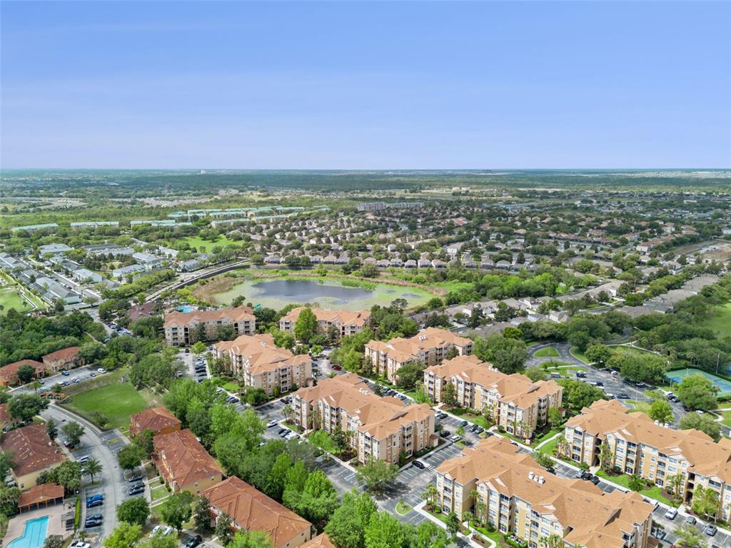 2809 Almaton Loop, Unit 401 Kissimmee, FL 34747 - Photo 31 of 59 an aerial view of a city and lake view