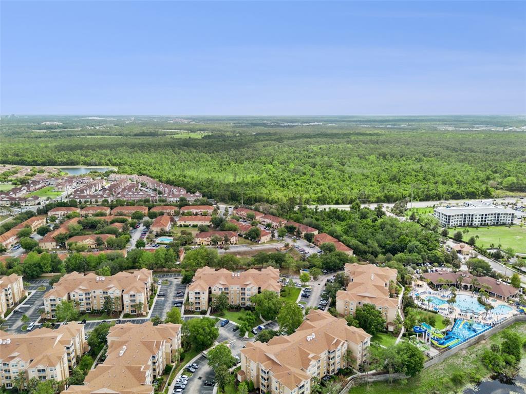 2809 Almaton Loop, Unit 401 Kissimmee, FL 34747 - Photo 34 of 59 an aerial view of a city and lake view