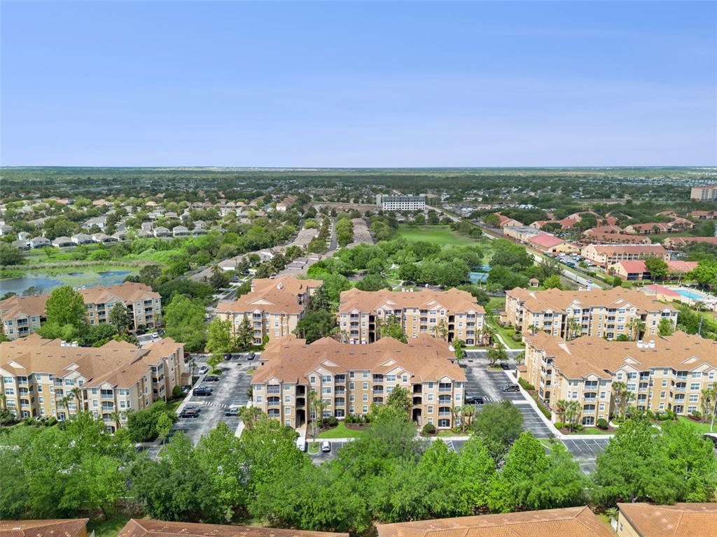2809 Almaton Loop, Unit 401 Kissimmee, FL 34747 - Photo 36 of 59 an aerial view of a city and lake view