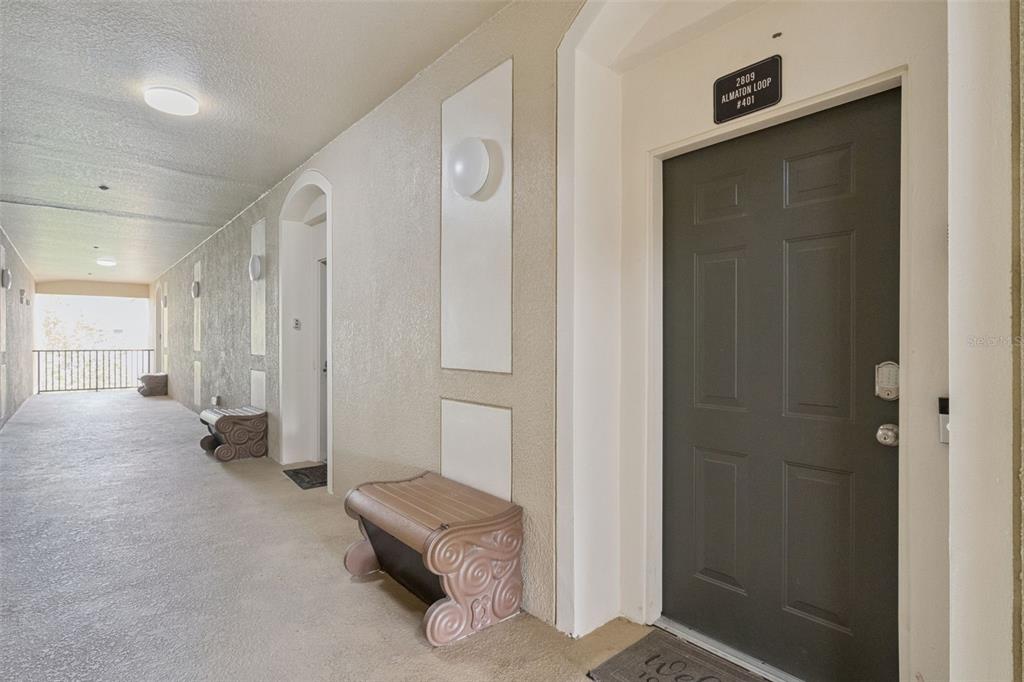 2809 Almaton Loop, Unit 401 Kissimmee, FL 34747 - Photo 4 of 59 a view of a hallway with some storage area