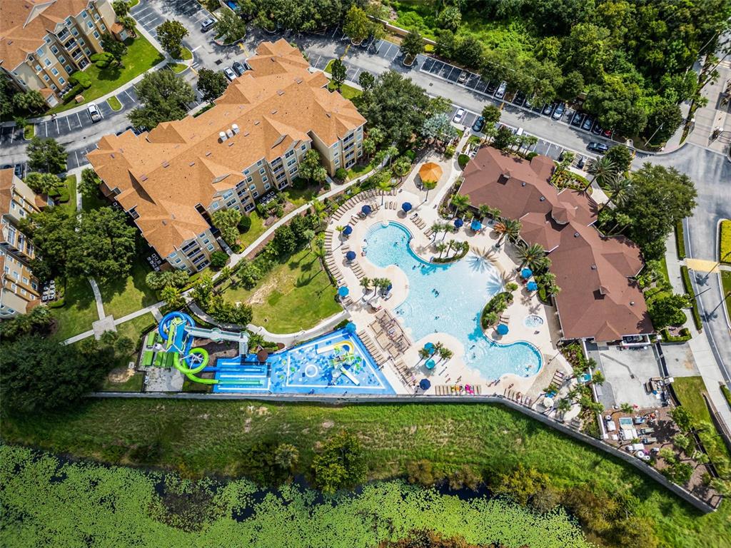 2809 Almaton Loop, Unit 401 Kissimmee, FL 34747 - Photo 55 of 59 an aerial view of residential houses with outdoor space and parking