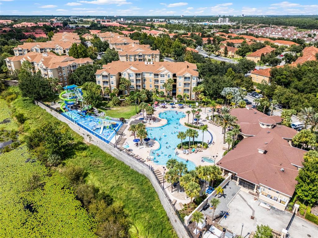 2809 Almaton Loop, Unit 401 Kissimmee, FL 34747 - Photo 56 of 59 an aerial view of residential houses with outdoor space
