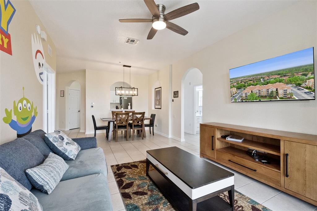 2809 Almaton Loop, Unit 401 Kissimmee, FL 34747 - Photo 6 of 59 a living room with furniture and a fireplace