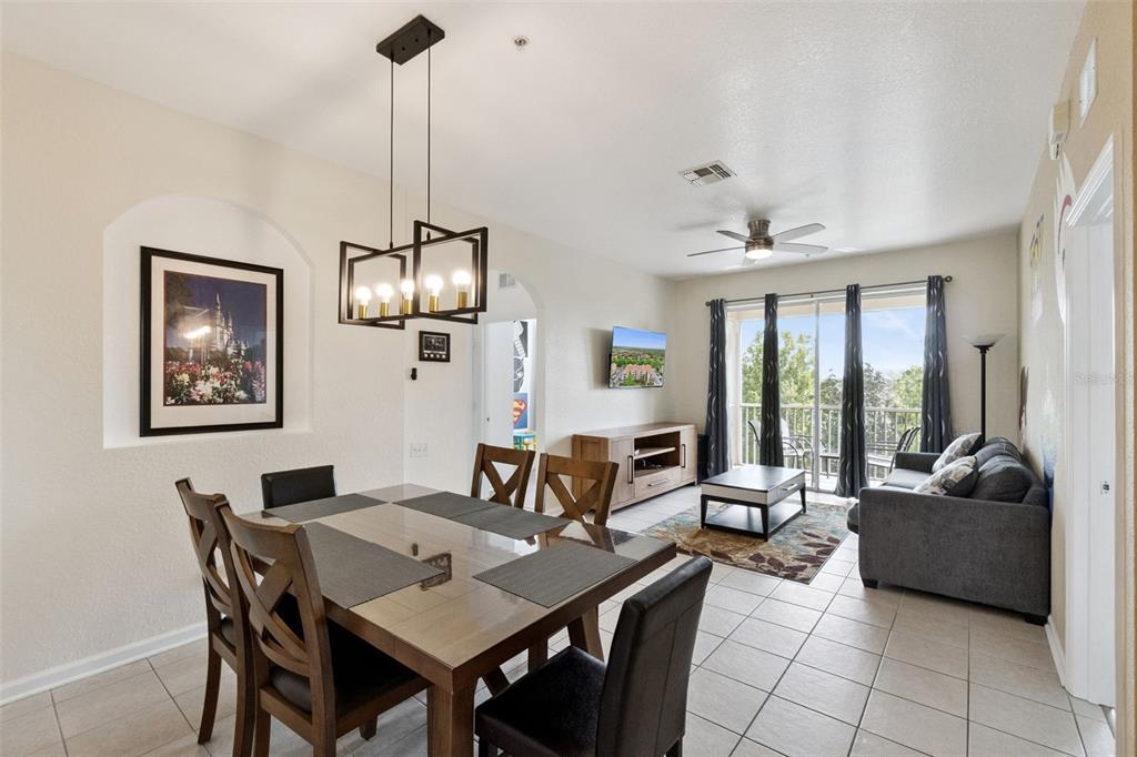 2809 Almaton Loop, Unit 401 Kissimmee, FL 34747 - Photo 7 of 59 a view of a dining room with furniture window and outside view