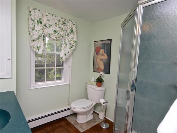 20 Farnham Circle Needham, MA 02492 - Photo 18 of 23 a bathroom with a toilet and a shower curtain