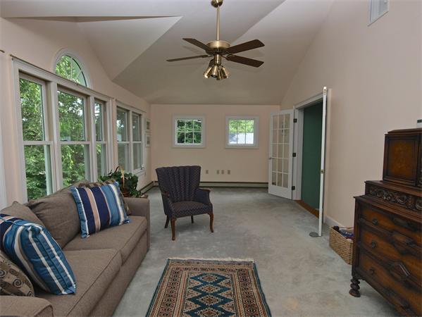 20 Farnham Circle Needham, MA 02492 - Photo 21 of 23 a living room with furniture a ceiling fan and a window