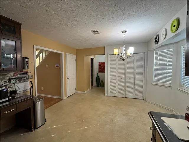 a view of a livingroom with a workspace