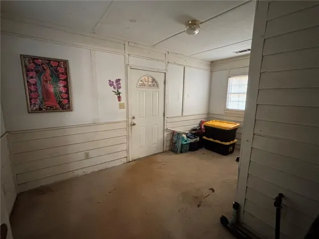 a view of a livingroom with furniture and window