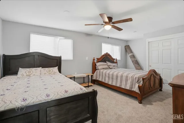 a view of a patio with table and chairs and potted plants