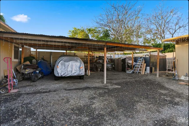 a living room with furniture a rug and a window