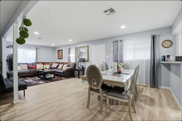 a living room with furniture a window and appliances
