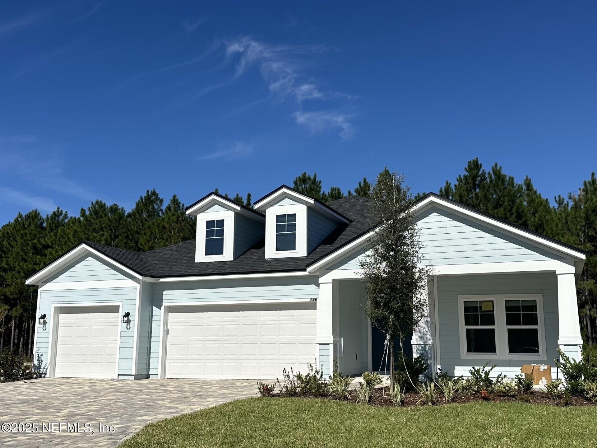 196 Silver Lily Way St. Augustine, FL 32092 - Photo 2 of 2 a front view of a house with a yard and garage