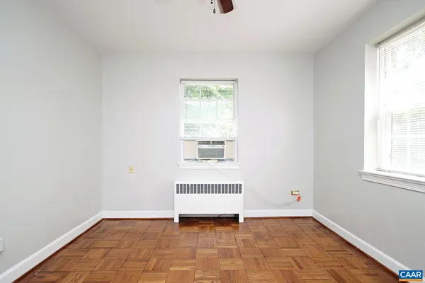 a view of an empty room with a window