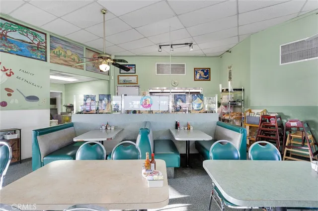 a living room with lots of furniture and a wooden floor