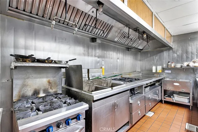 a kitchen with a stove and a stove