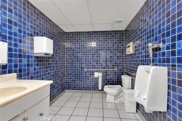 a bathroom with a toilet and a sink