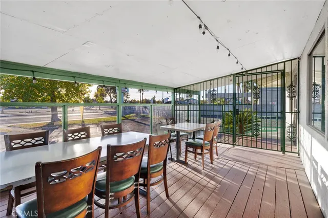 a dining room with furniture window and outside view
