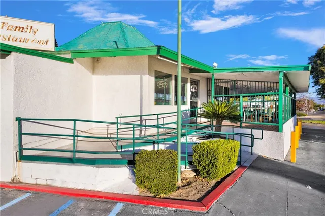 swimming pool view with a seating space