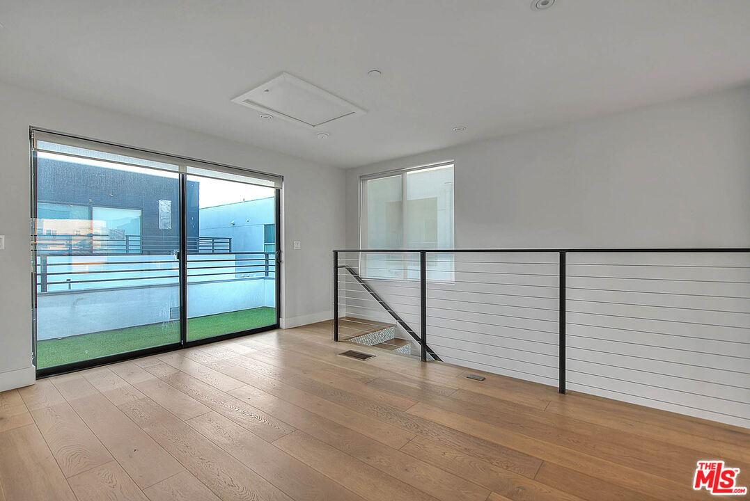 5014 Rosewood Avenue, Unit 1/2 Los Angeles, CA 90004 - Photo 14 of 45 a view of a livingroom with wooden floor