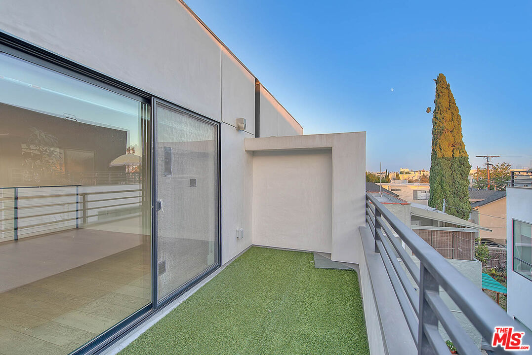 5014 Rosewood Avenue, Unit 1/2 Los Angeles, CA 90004 - Photo 15 of 45 a balcony view with a backyard space
