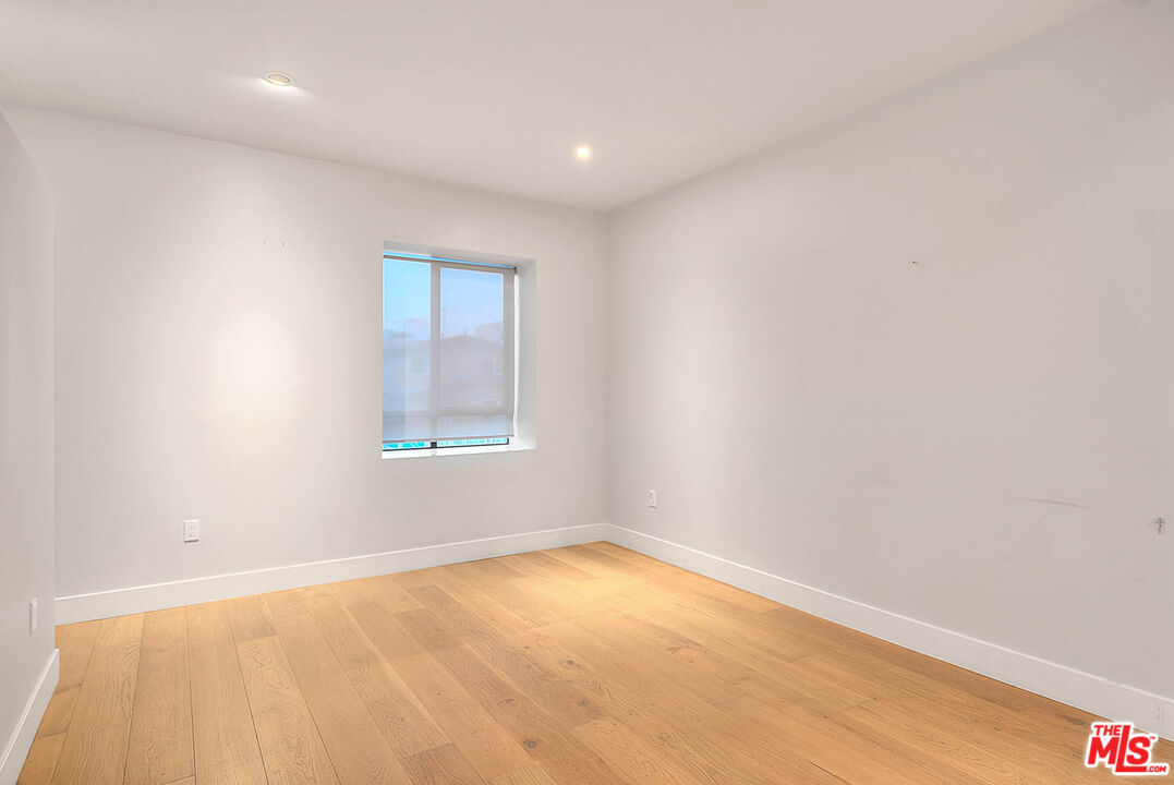 5014 Rosewood Avenue, Unit 1/2 Los Angeles, CA 90004 - Photo 19 of 45 an empty room with a window