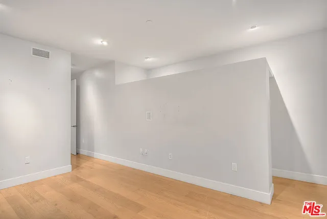 a view of a room with racks on the wall