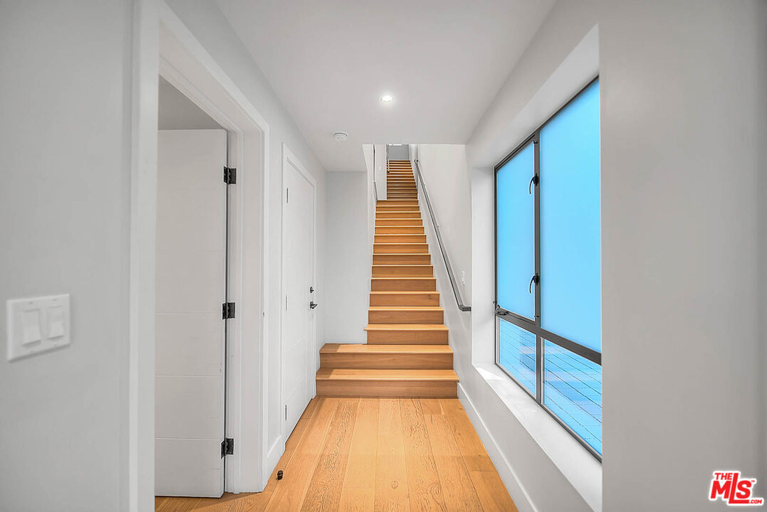 5014 Rosewood Avenue, Unit 1/2 Los Angeles, CA 90004 - Photo 30 of 45 a view of a hallway with stairs