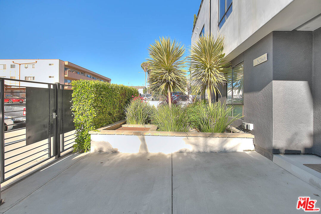 5014 Rosewood Avenue, Unit 1/2 Los Angeles, CA 90004 - Photo 38 of 45 a view of a street with a building in the background