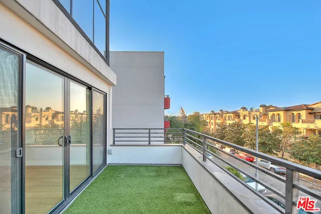 a view of balcony with furniture